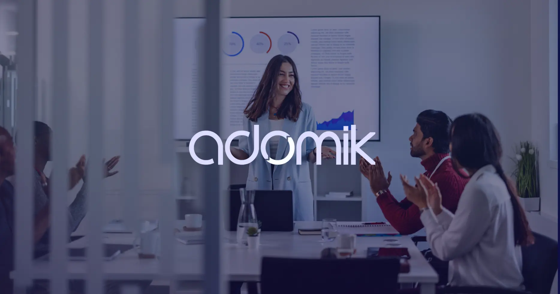 Adomik case study cover featuring a presenter discussing performance metrics with an engaged audience in a conference room.